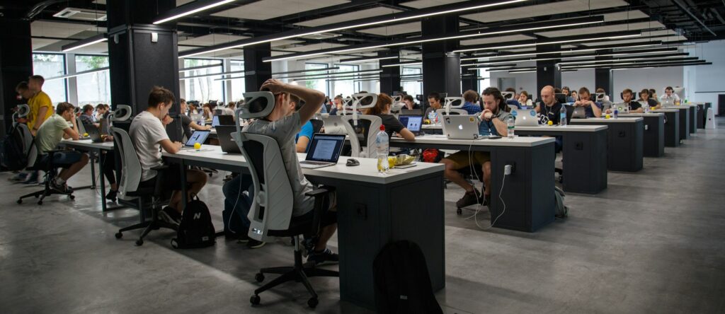 People working on computers in a big office