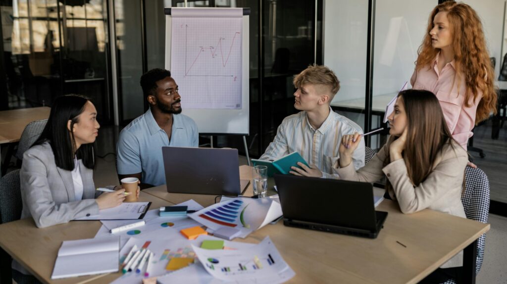people in office working on laptops