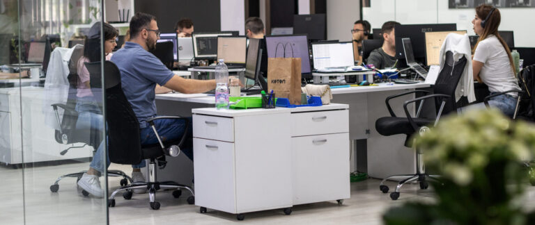 people working in an outsourcing company office