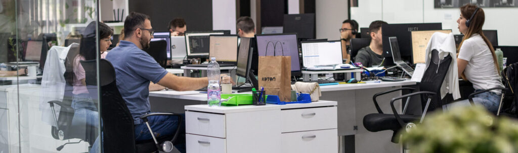 people working in an outsourcing company office
